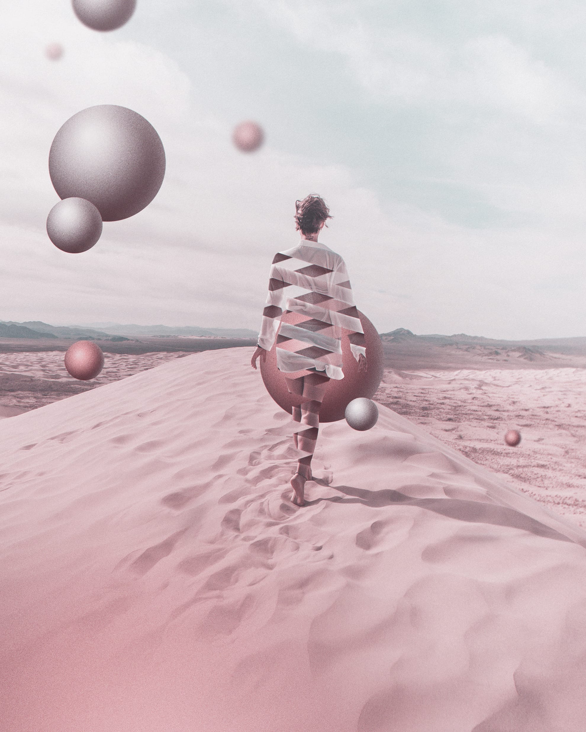 A person walks along a sandy ridge in a surreal desert. The person's figure is artistically fragmented into triangular sections, revealing the landscape behind. Large geometric spheres float around, and a ribbon of time weaves through the scene. Soft pinks and earthy shades give it a dreamlike quality.