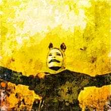 A colorful, abstract painting features a person with arms outstretched against a vibrant yellow background. The person has a painted face with a mustache and is wearing cat-like ears. The artwork uses bold brush strokes and a mix of bright colors for a textured, dynamic feel.