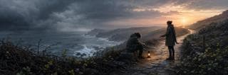 Two people walk a coastal path at sunset, pausing near a glowing lantern as waves crash beneath storm clouds.