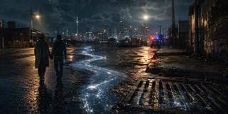 Two people walk hand in hand on a wet street at night as Nature & Reflection glow in a starry trail toward the Zulu city skyline.